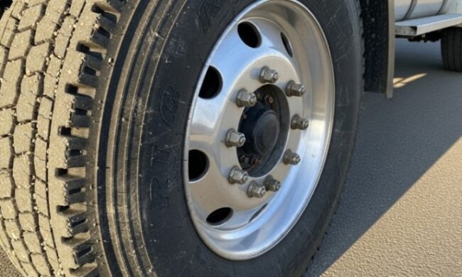 Close-up of a truck's front wheel