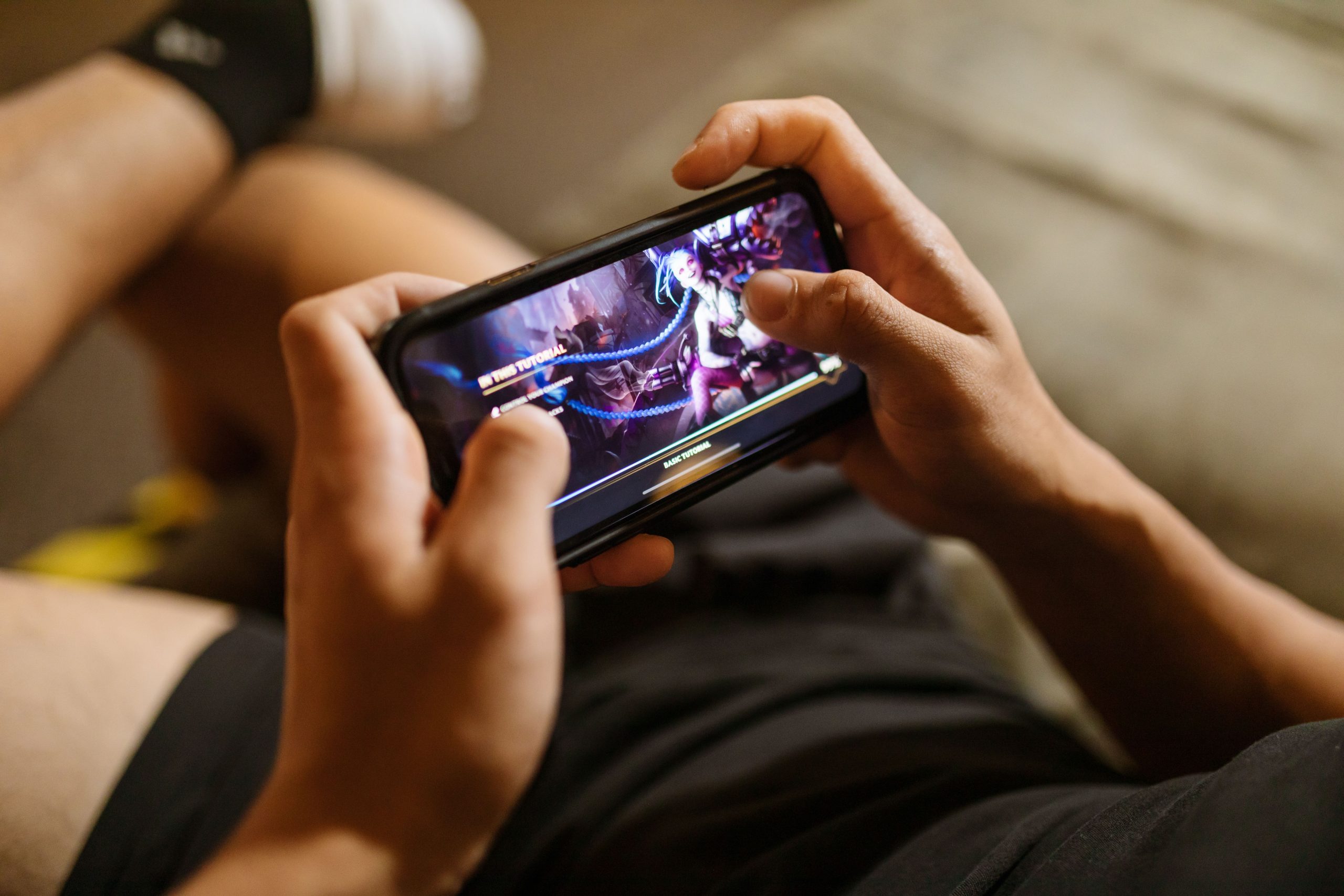 Person playing a real money gaming app on a smartphone